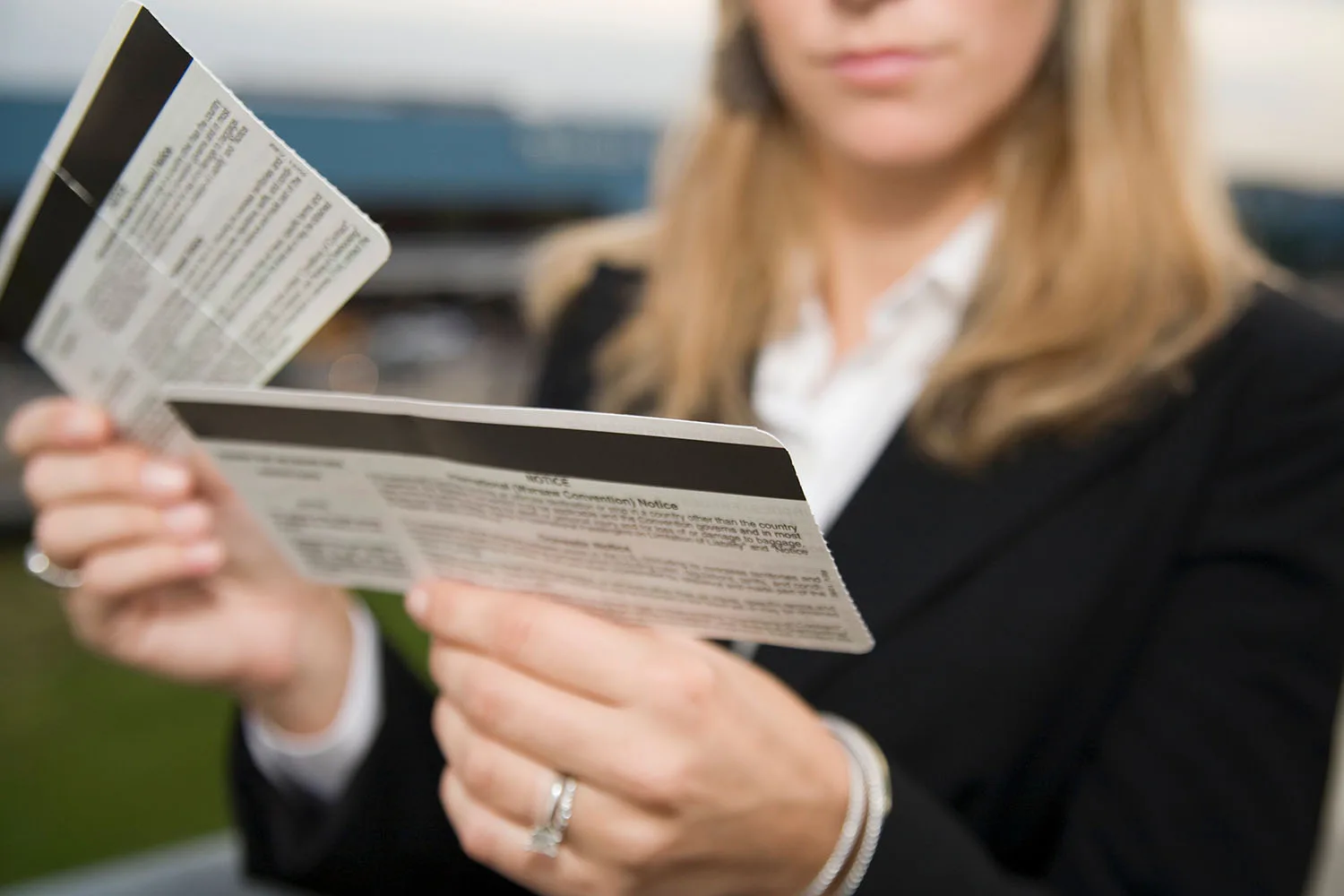 airline agent checking boarding pass