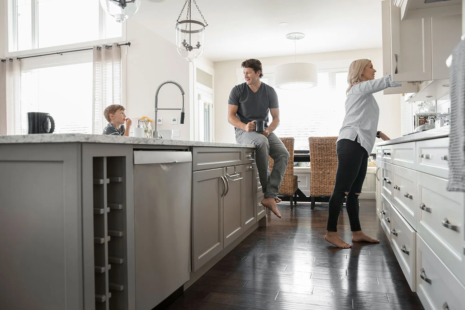 people standing in kitchen