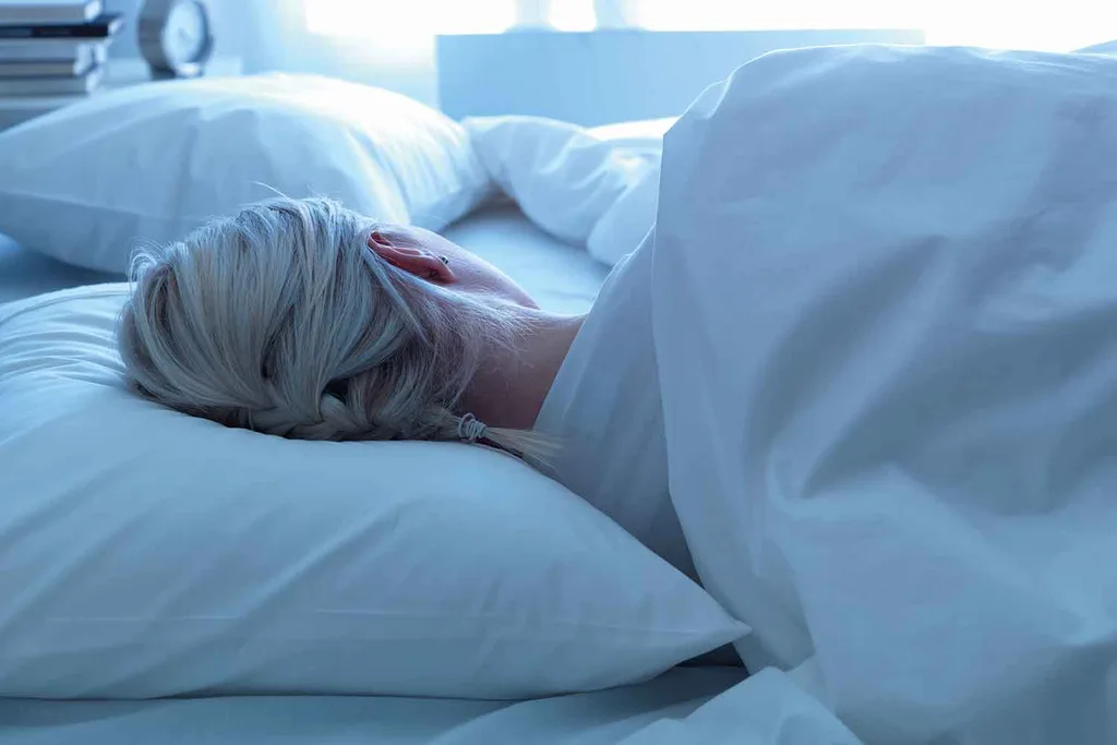 woman sleeping in bed