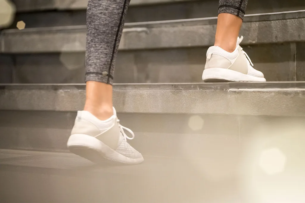 Woman running up stairs
