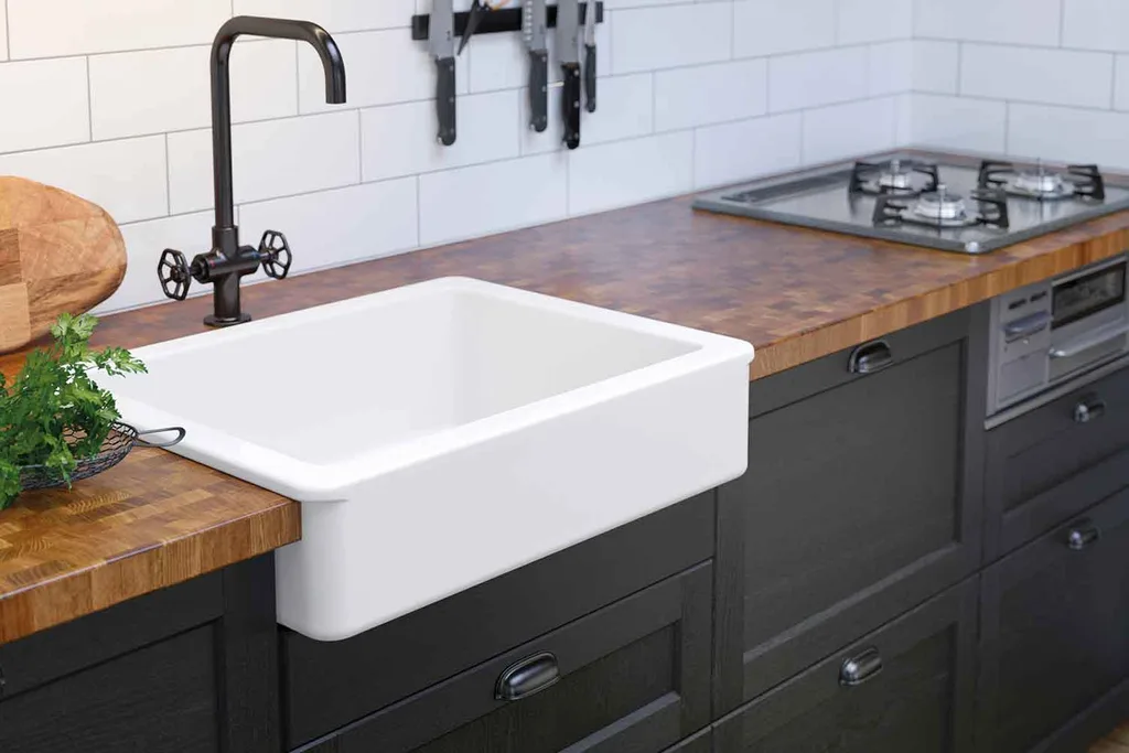 Black kitchen with white butler's sink