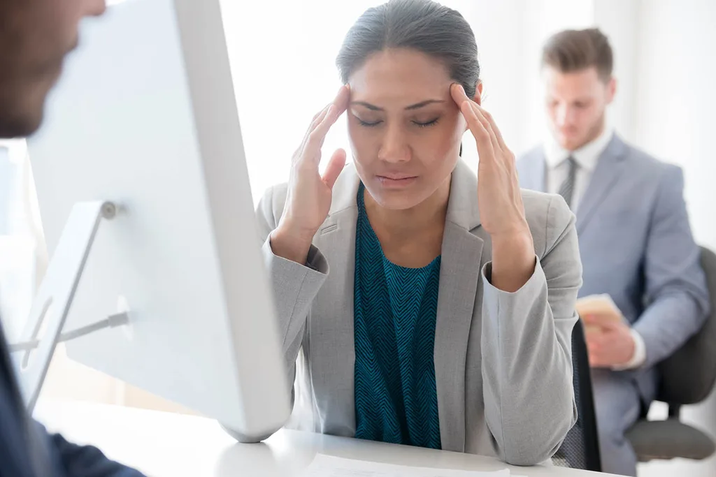 woman massaging head
