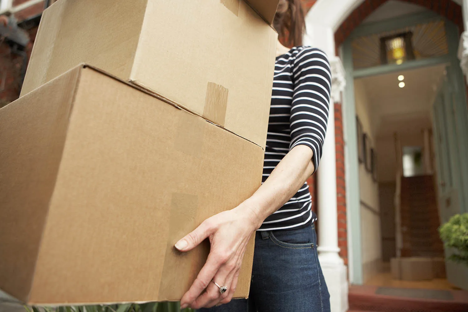 woman carrying boxes