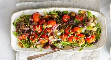 Warm roasted olive, tomato and rocket salad with toasted ciabatta crumble