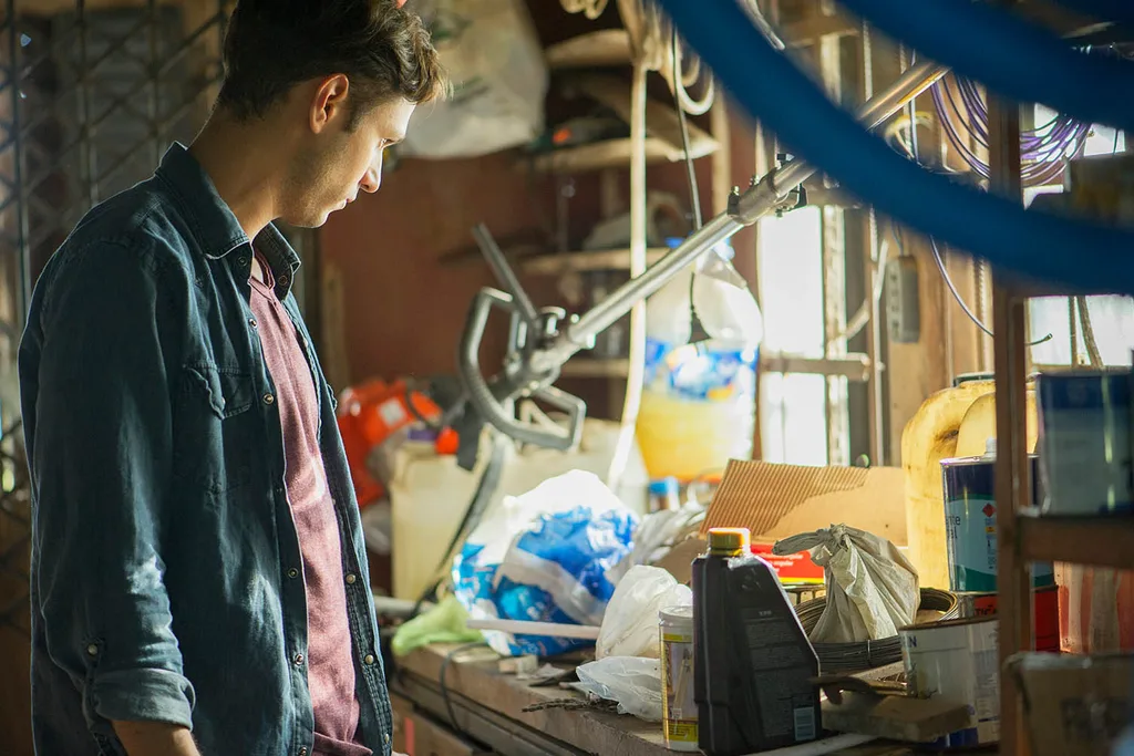 man in messy attic