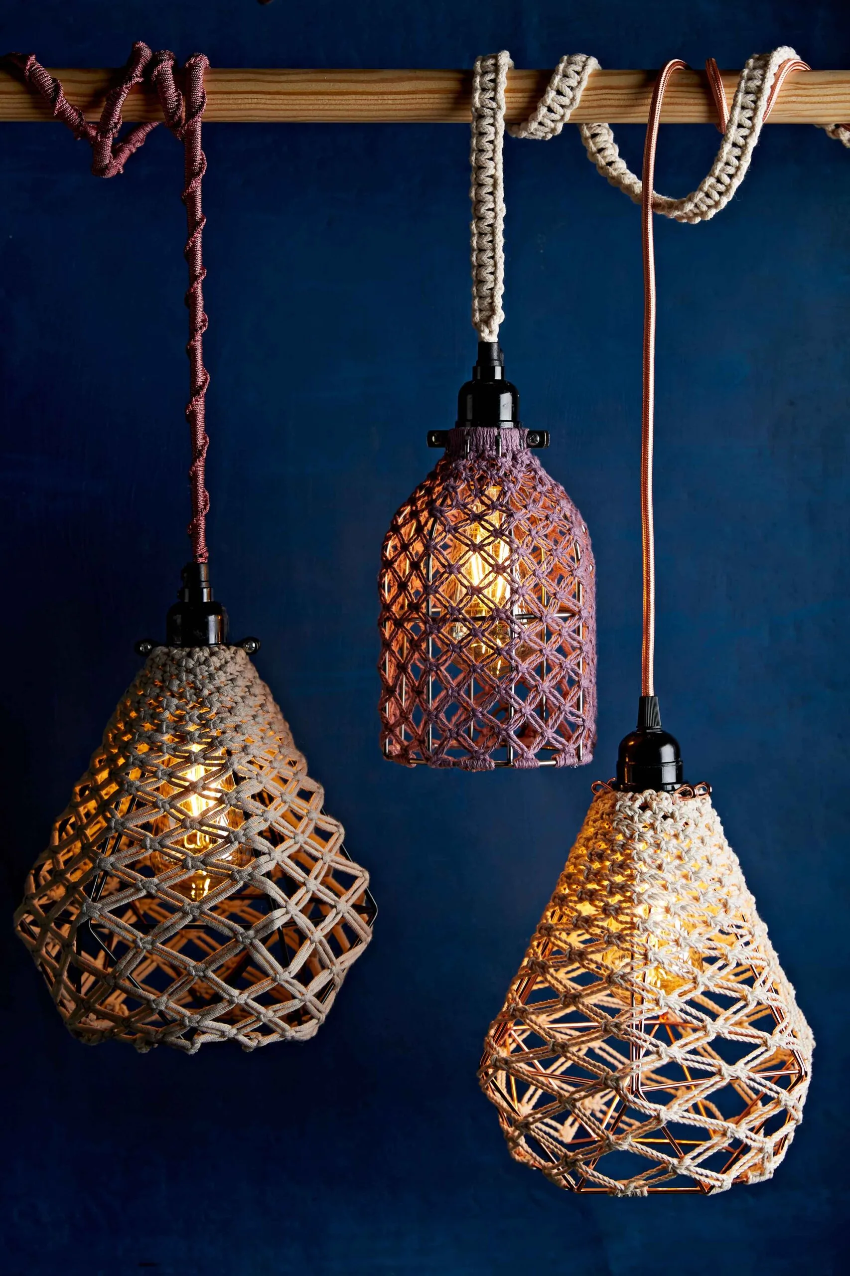 Dark blue wall and woven pendant lights