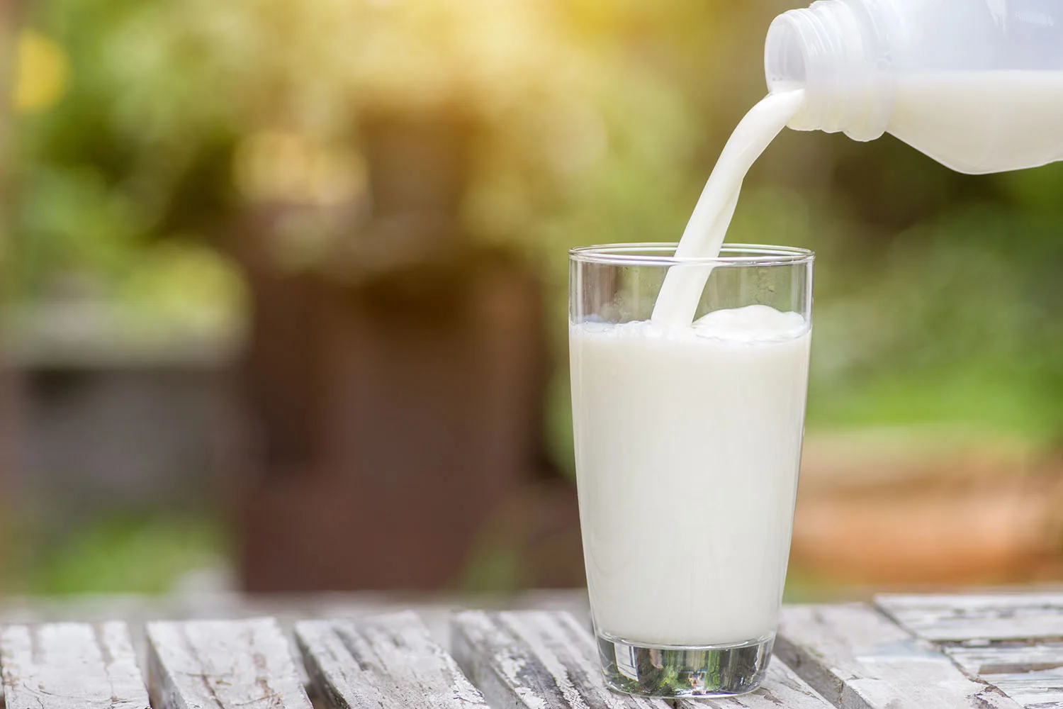 pouring milk into glass