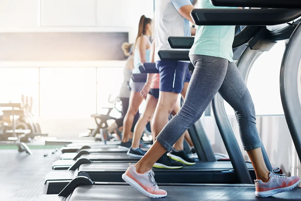 people walking on treadmills