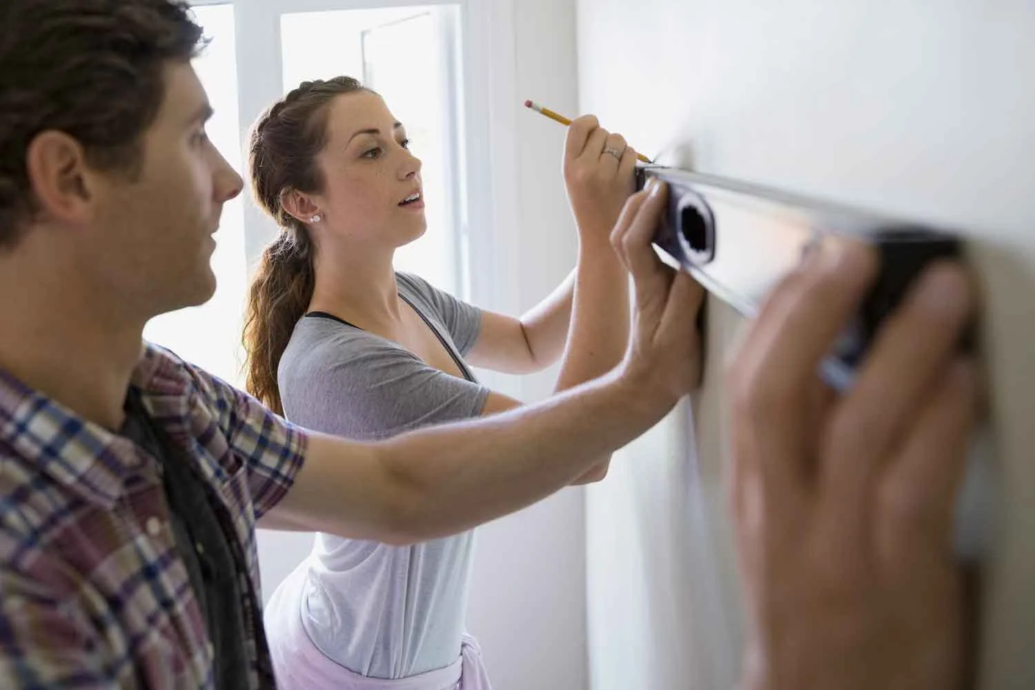 Use spirit level to hang pictures