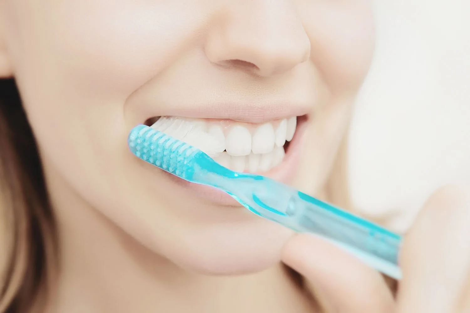 woman brushing teeth