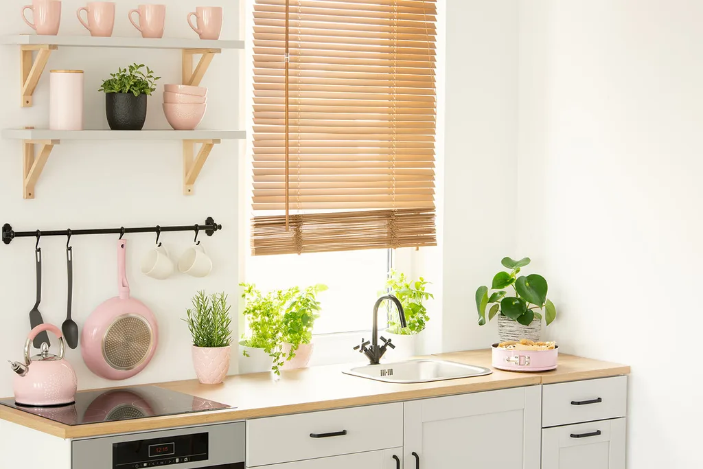 kitchen with pink appliances and dinner ware