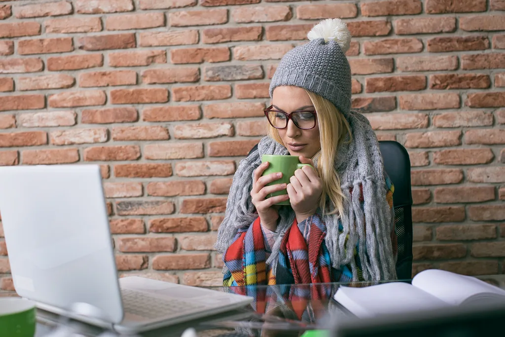 woman studying in scarf and beanie