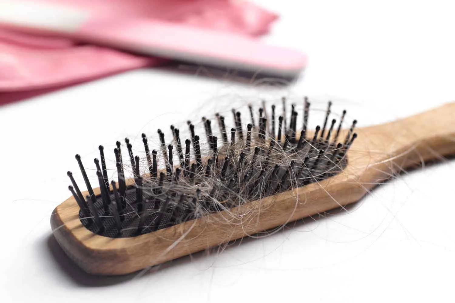 Hairbrush with tangled hair
