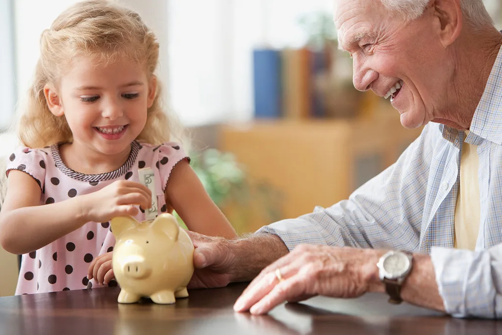 old man with little girl and piggy bak