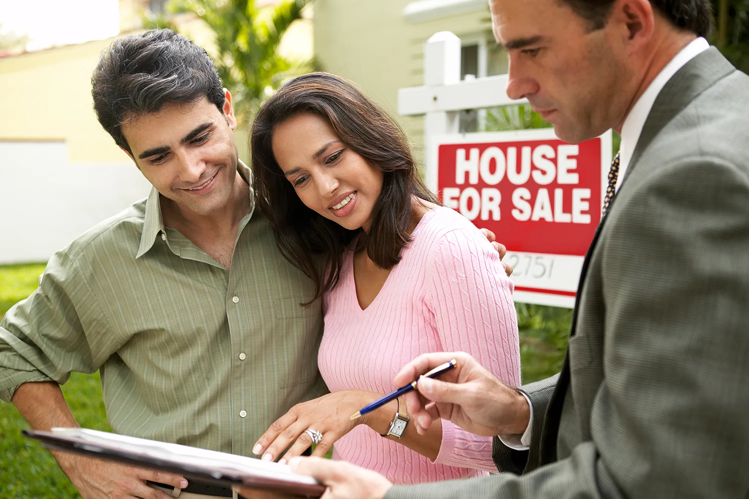 couple and real estate agent