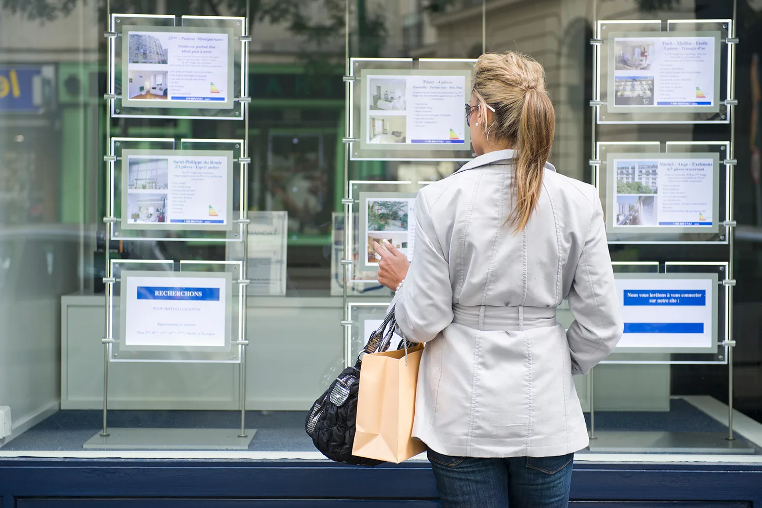 woman looking at real estate ads