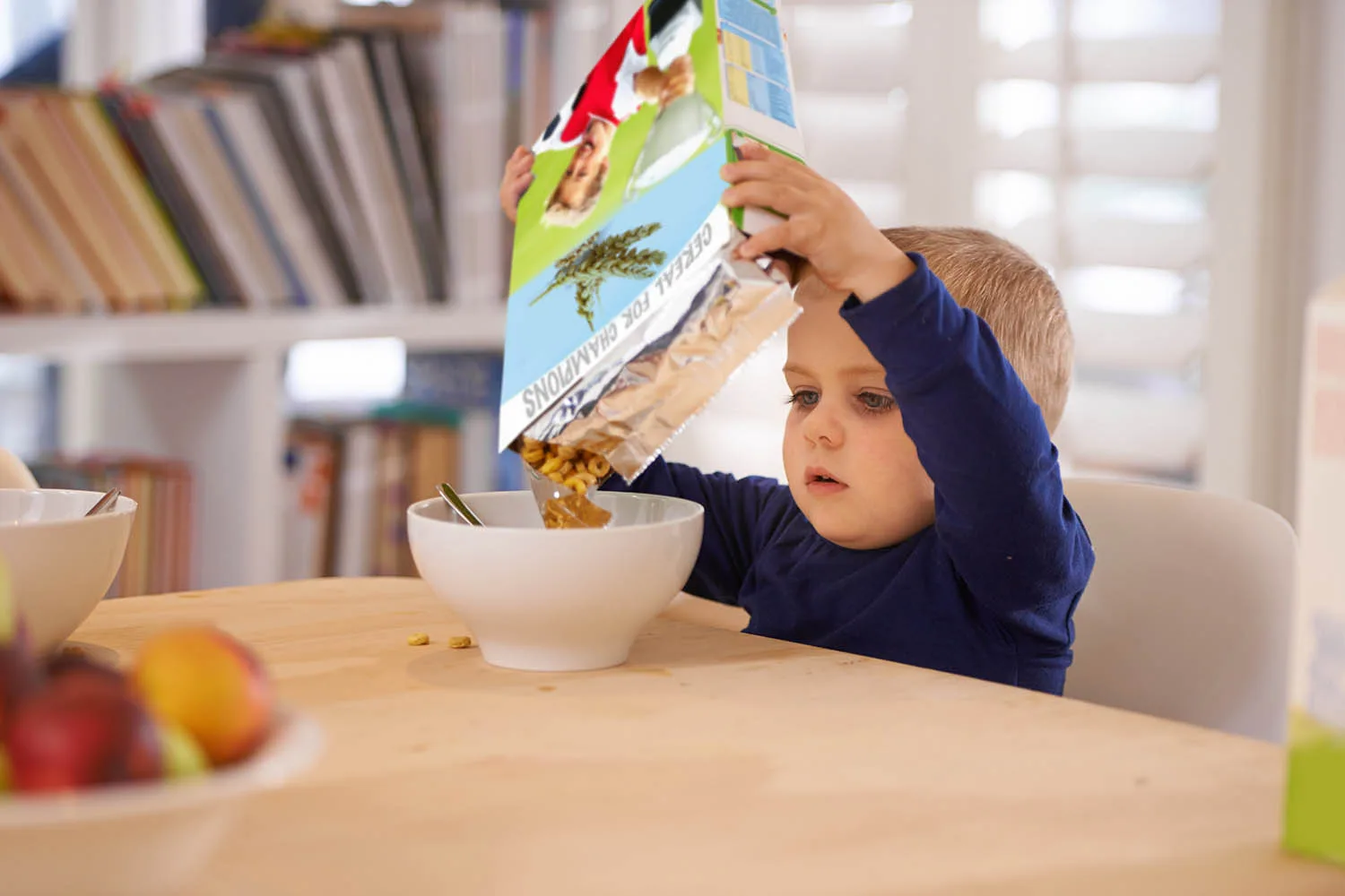 child with cereal box