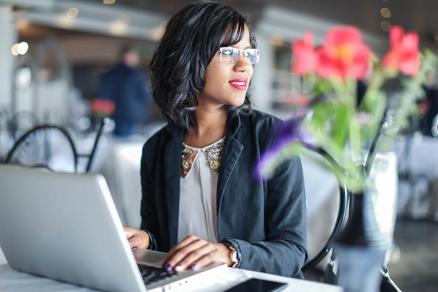 woman writing on laptop