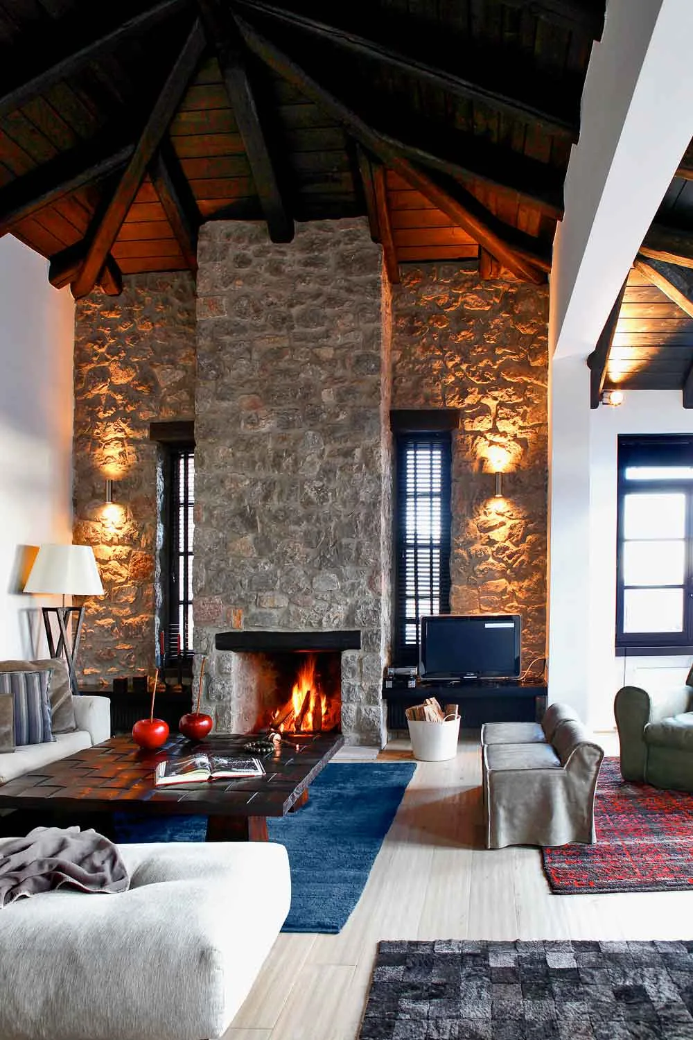Stone fireplace in a cosy living room