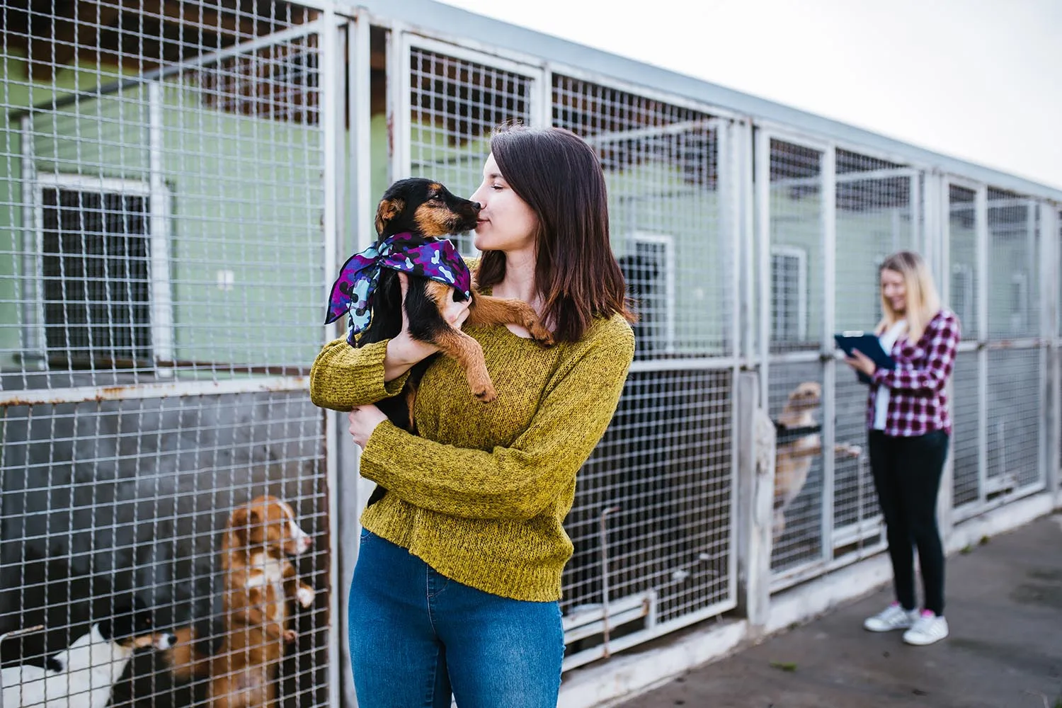 woman holding dog