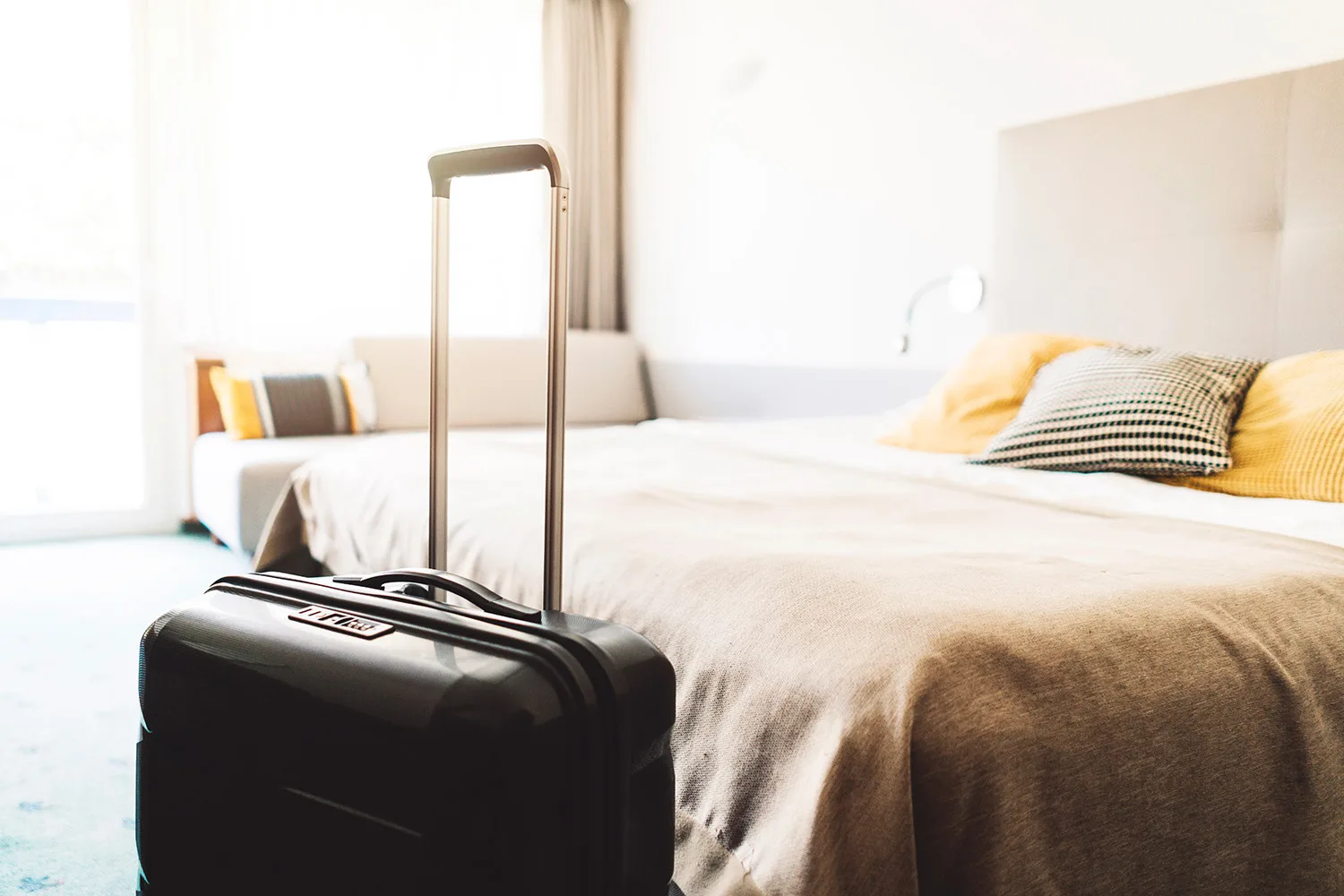suitcase standing in bedroom