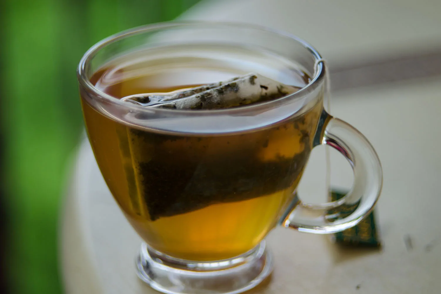 cup of green tea with teabag