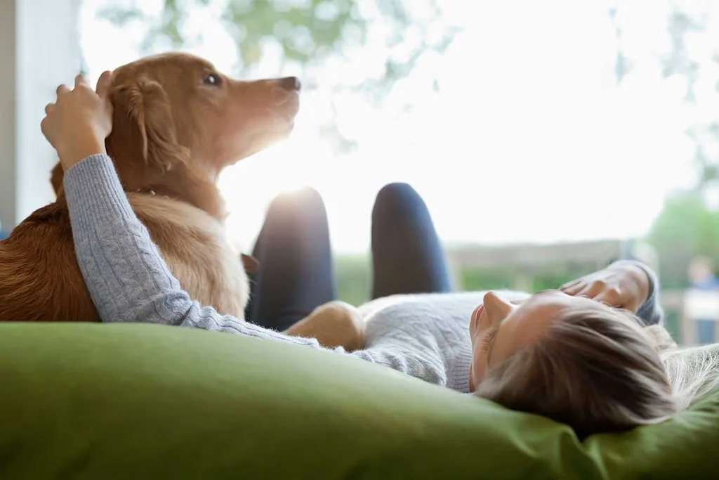 Woman lying down with dog