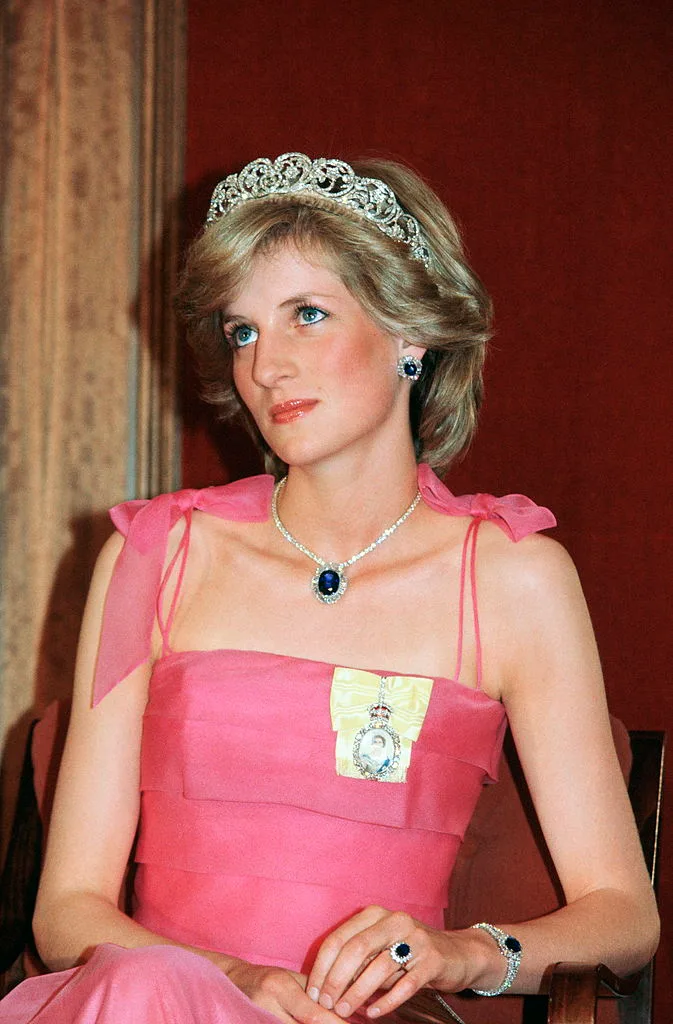 The late Princess Diana wearing the Spencer family tiara with a suite of sapphire and diamond jewels