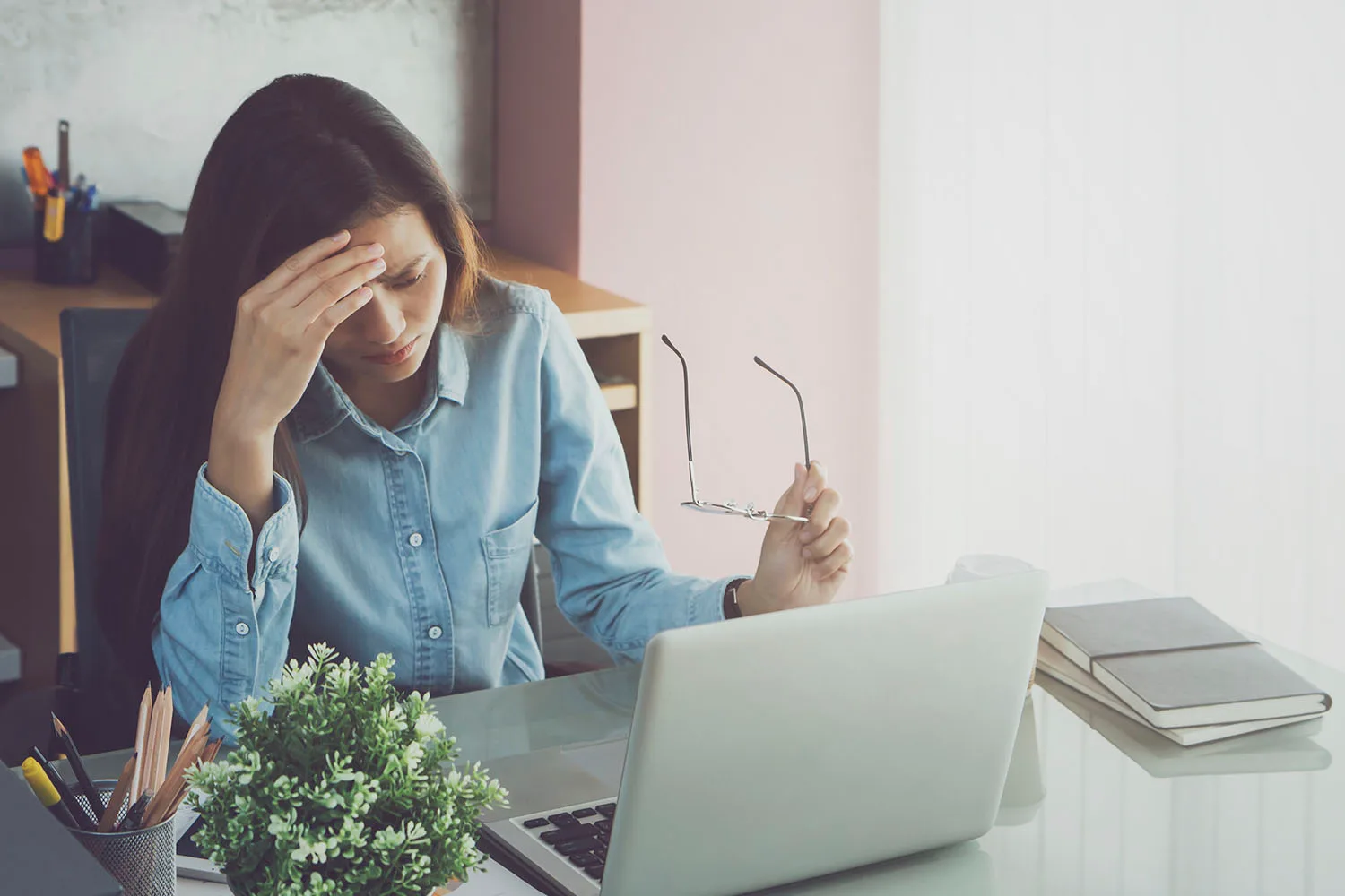 woman looking stressed at computer
