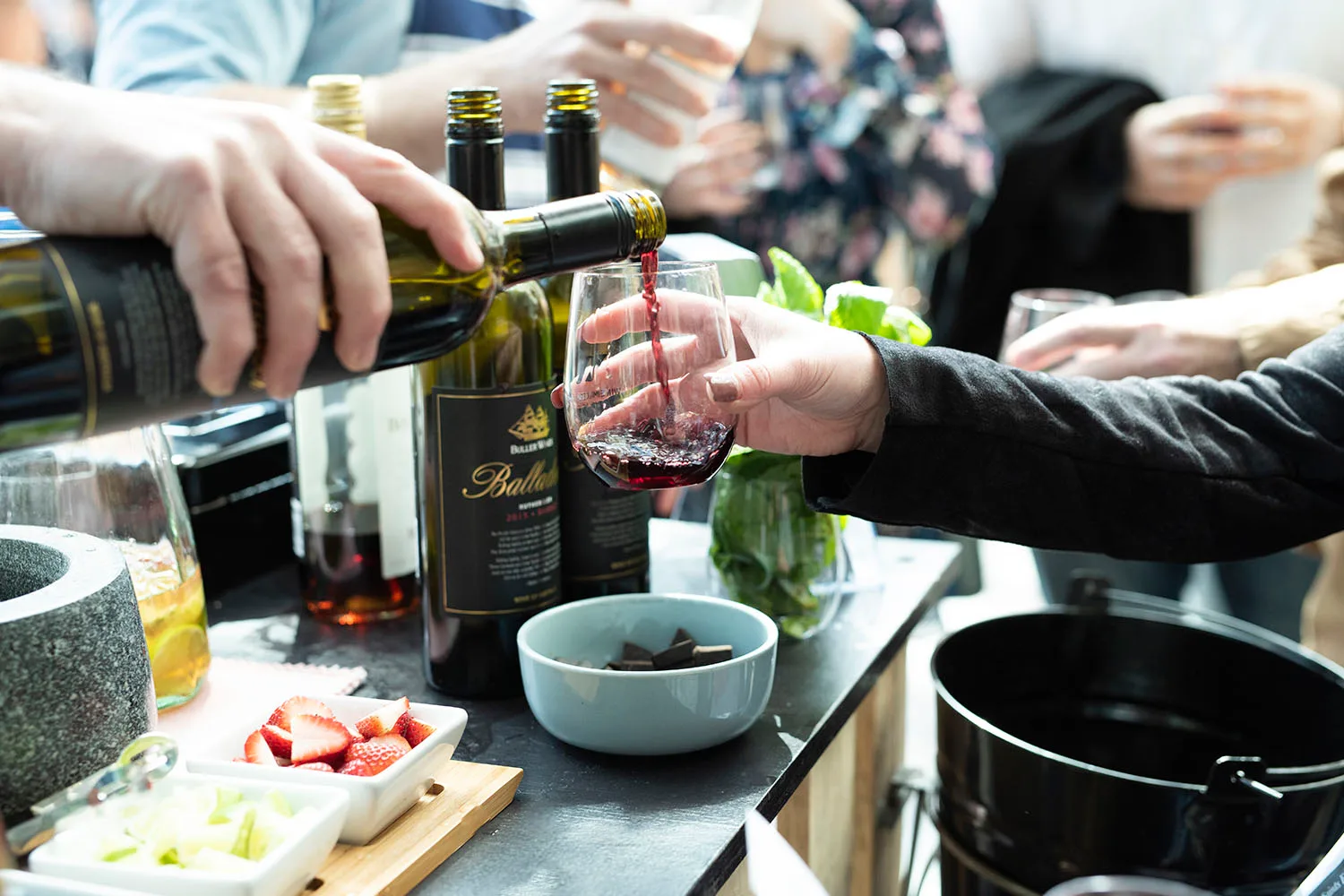 pouring red wine into glass
