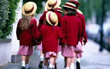 What is the legal age a child can walk to school alone?