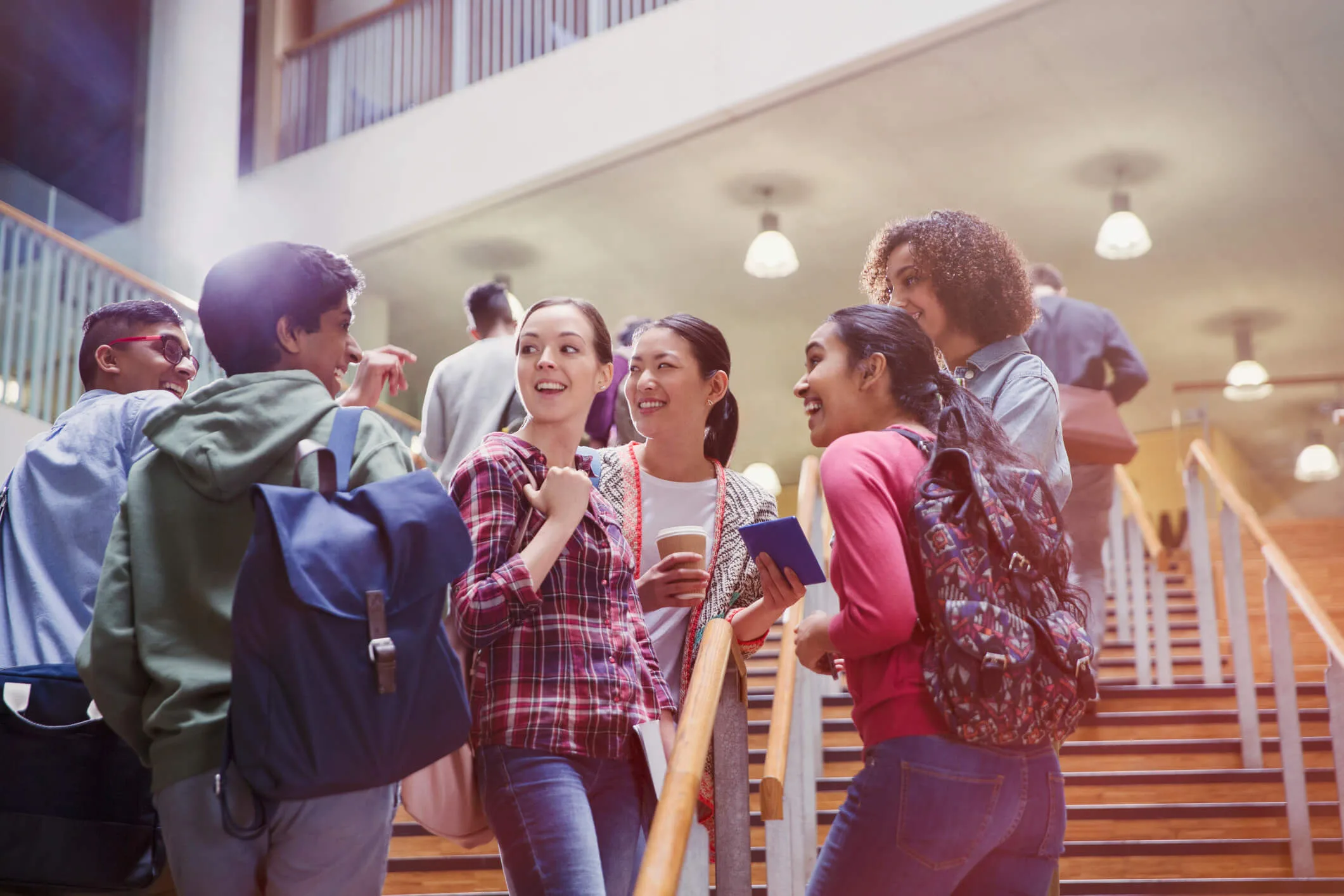 College students chatting in a stairway
