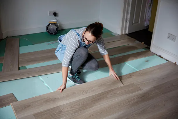 Woman lying floating floorboards
