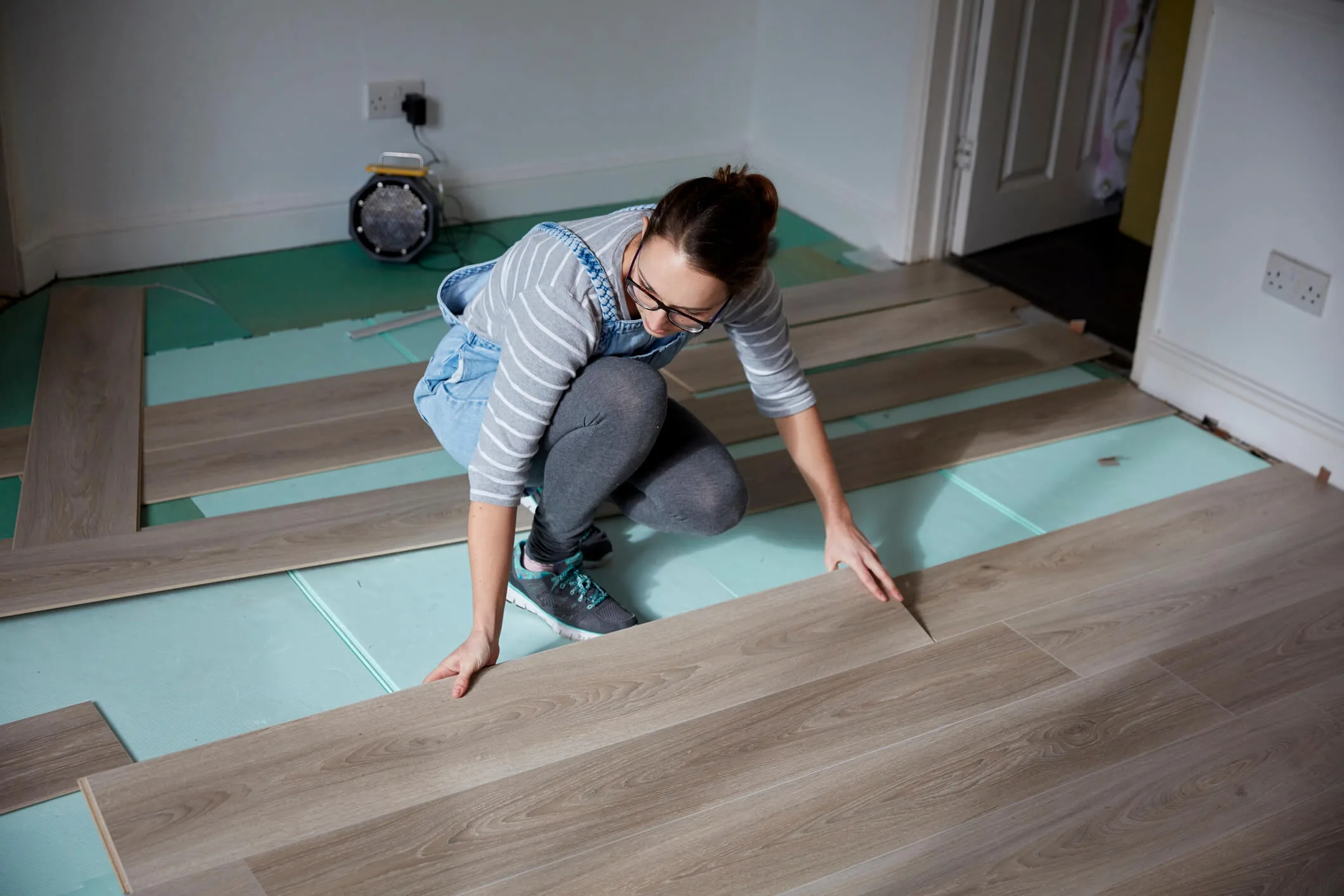 Woman lying floating floorboards