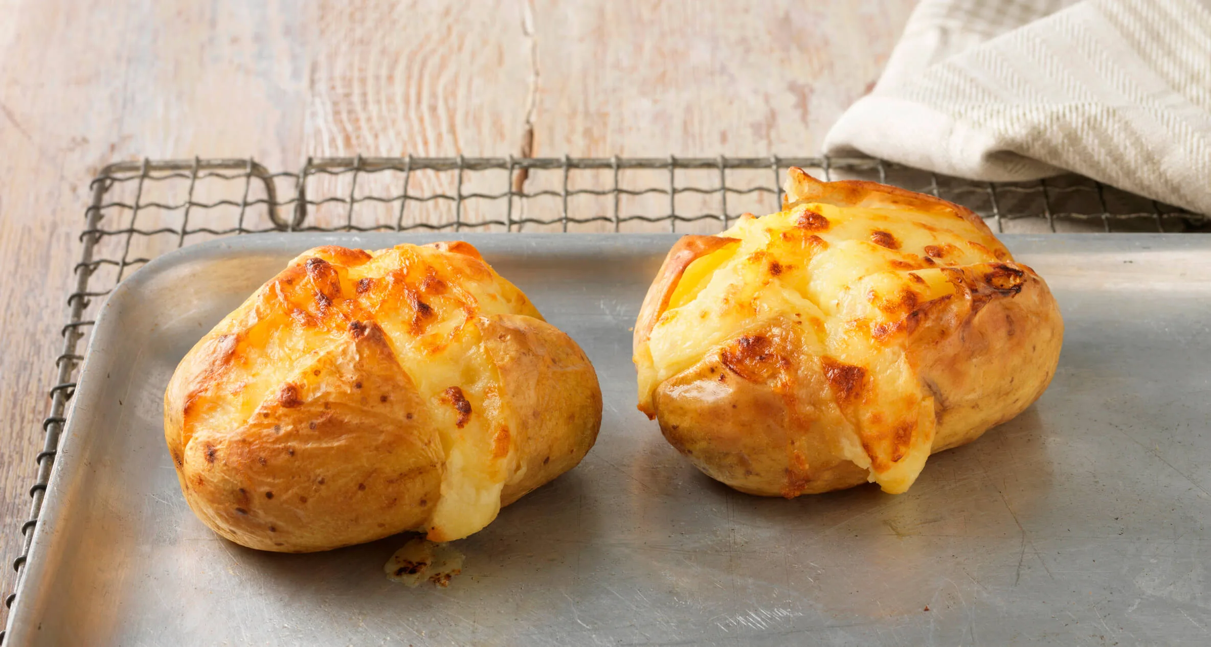 Baked potatoes on an oven tray
