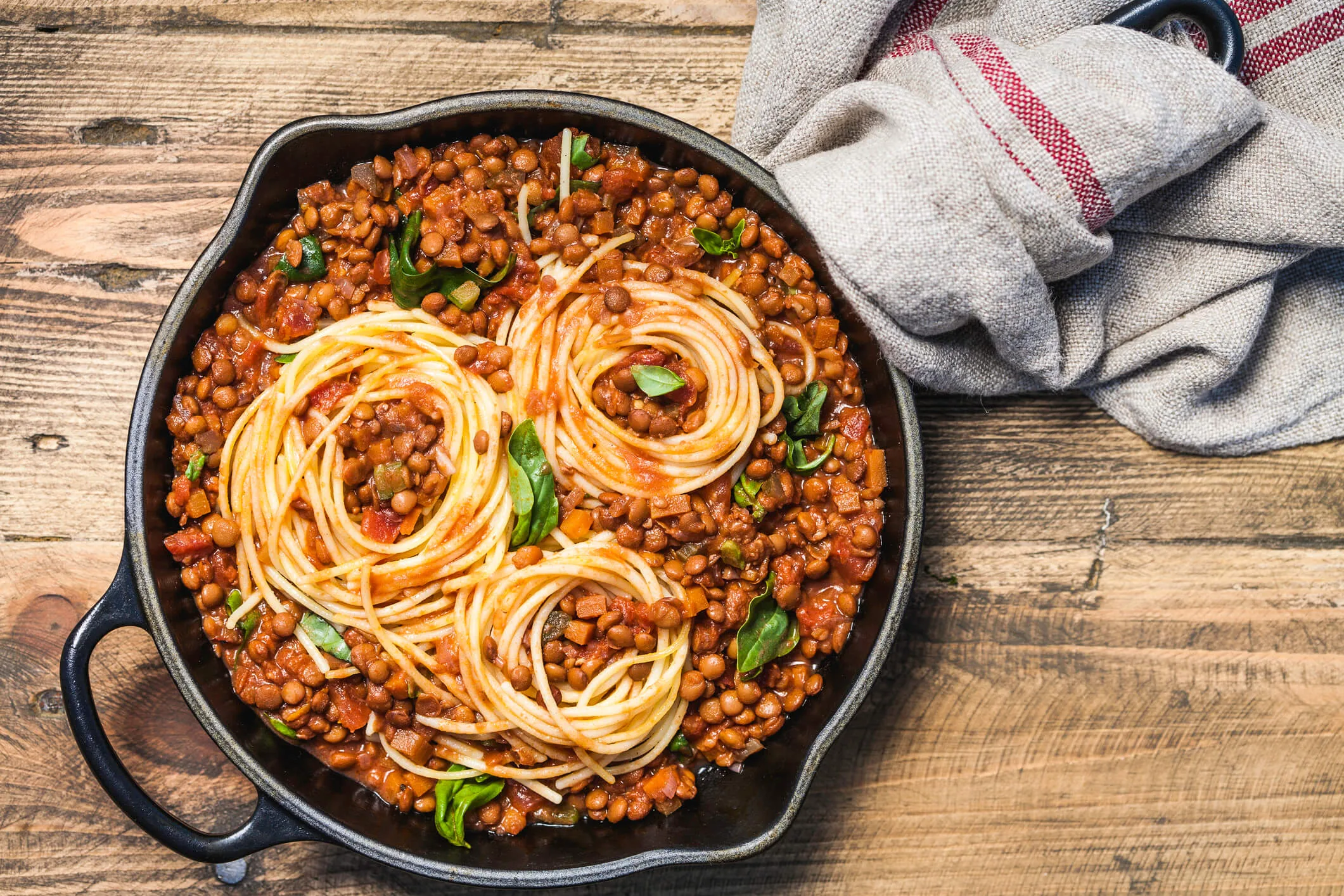 A pot of pasta on a wooden table