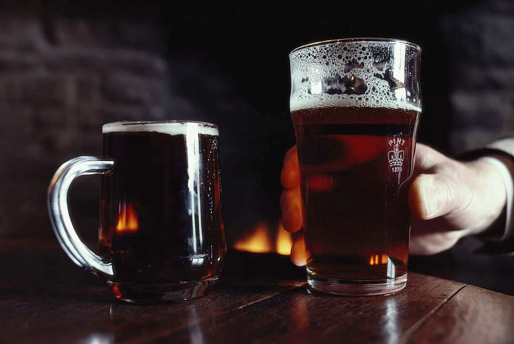Two pints of ale in a bar