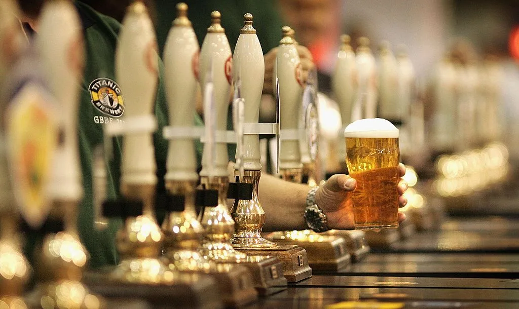 A man serving beer at the 2006 The Great British Beer Festival