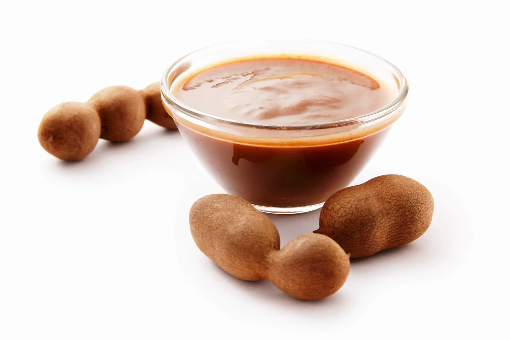Tamarind concentrate against a white background