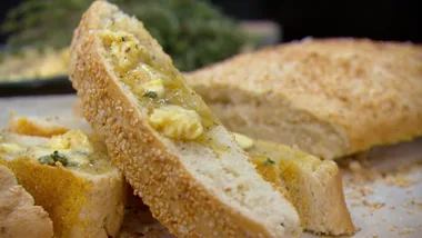 Semolina and sesame bread with roasted garlic butter