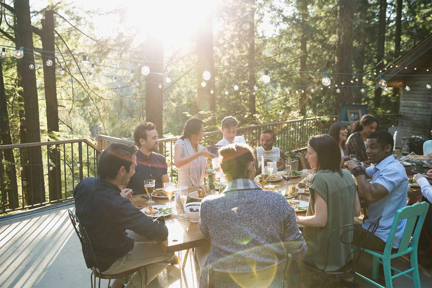 People eating at table outdoors