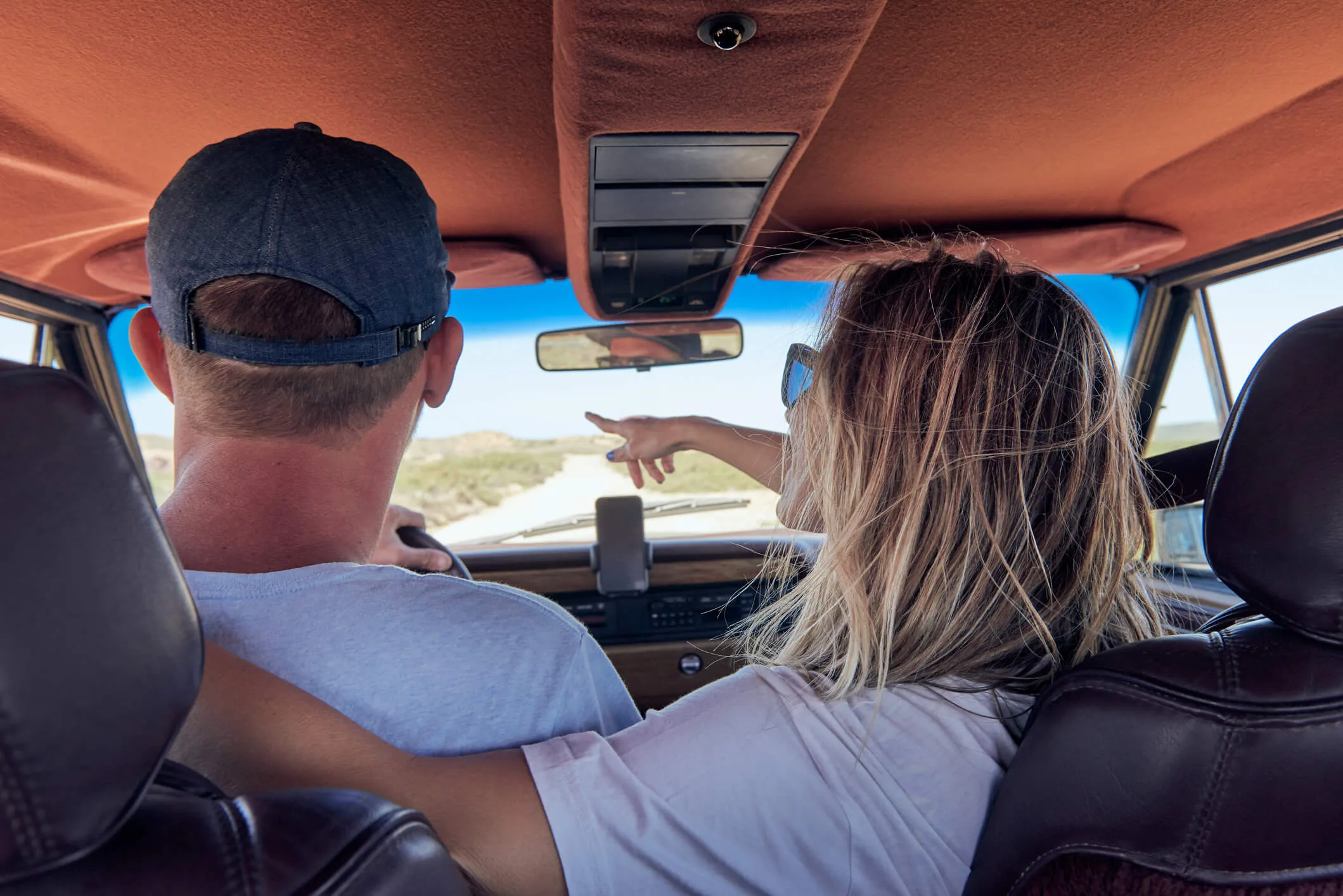A couple in a car on a roadtrip