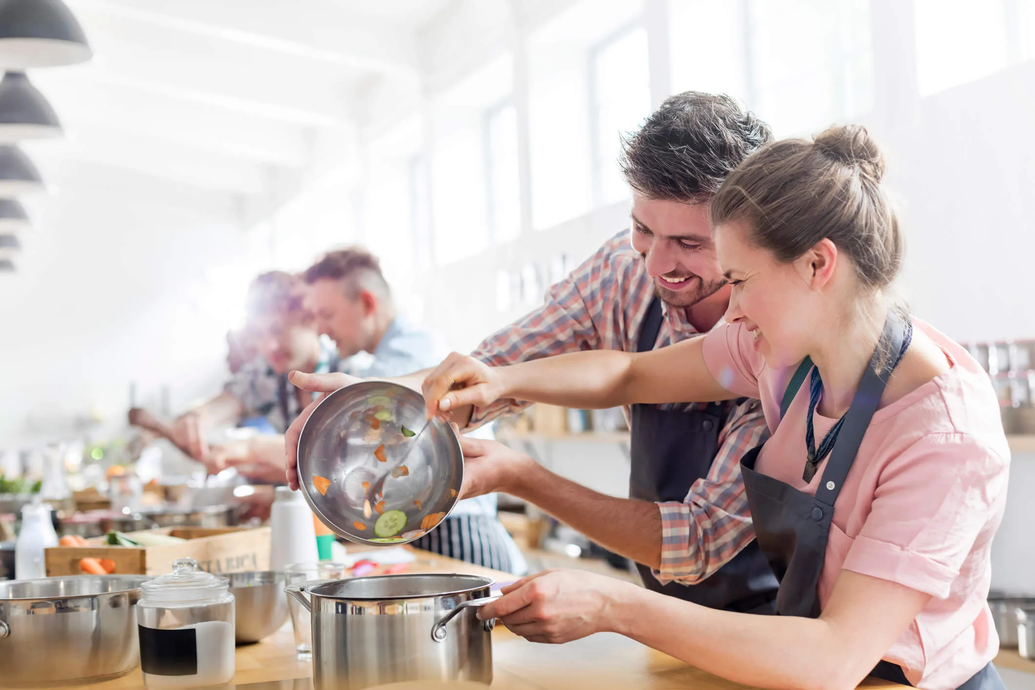 A couple doing a cooking class together
