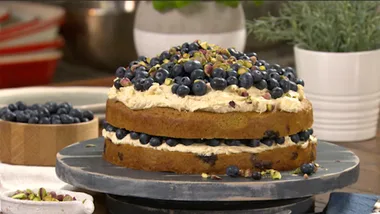 Rich layered blueberry and pistachio cake