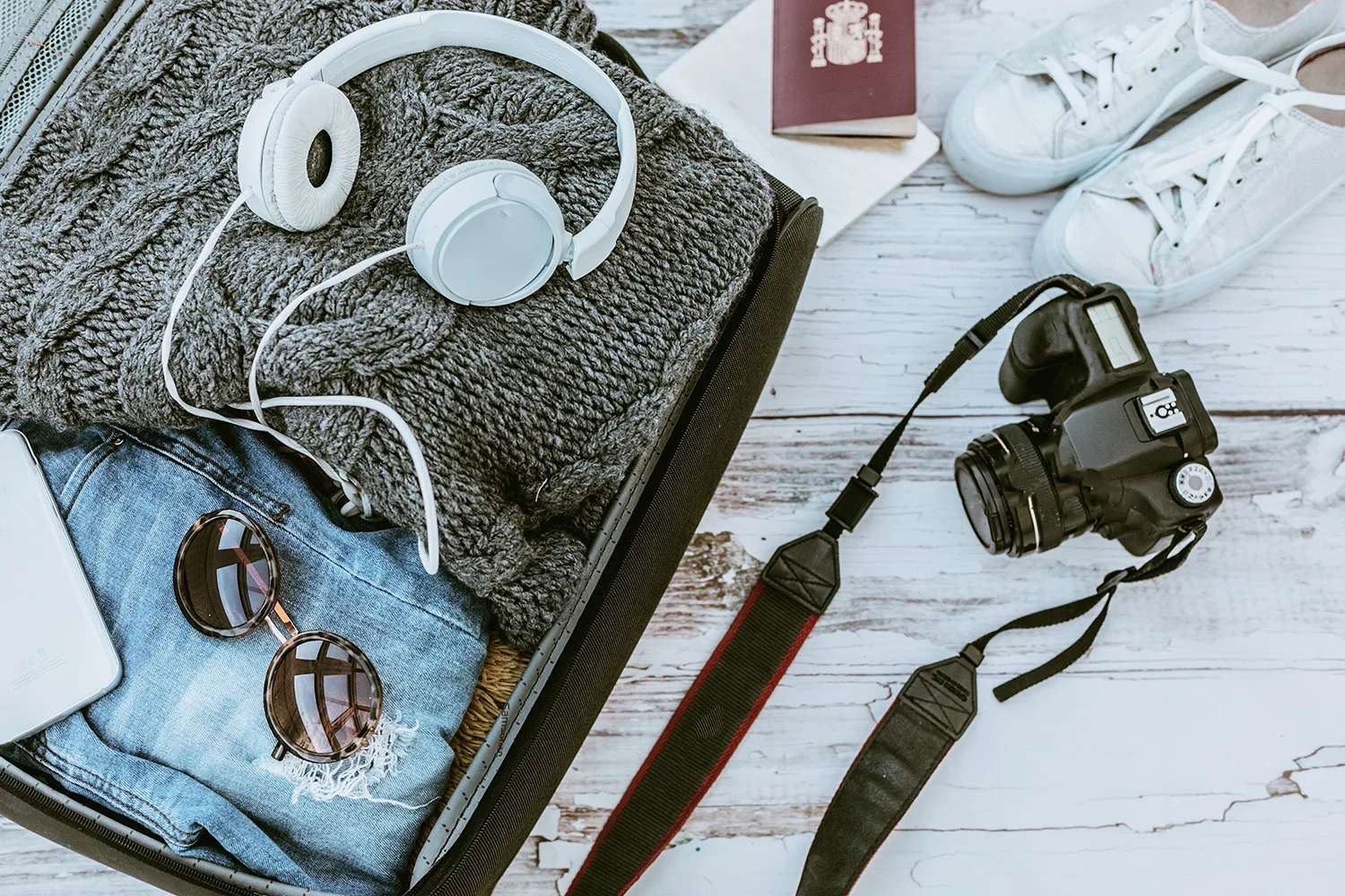 travel essentials camera headphone passport