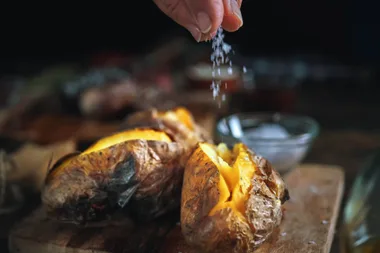 A roasted potato with salt
