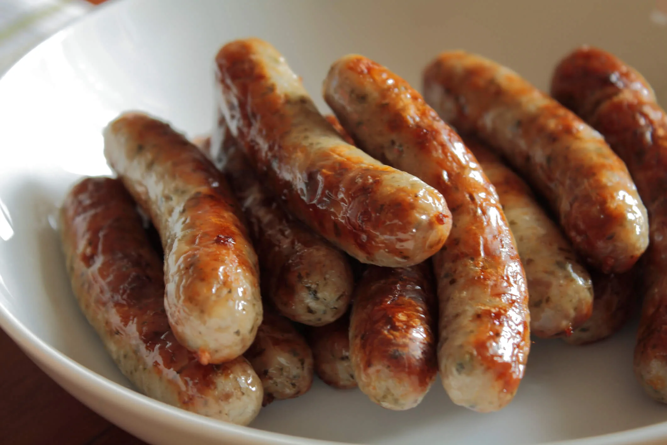 Sausages in a white bowl