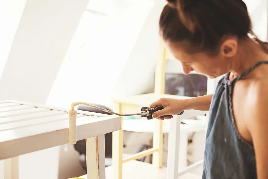 Woman painting table