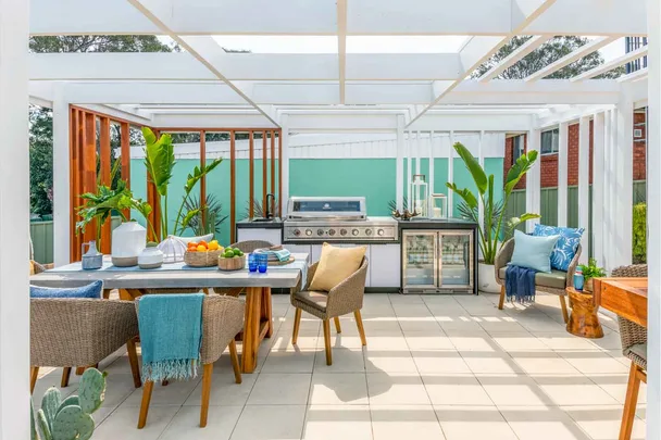 Outdoor dining area under a pergola
