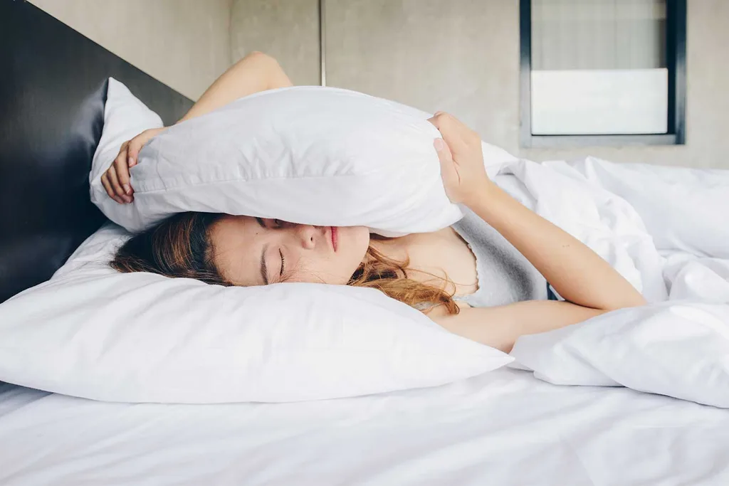 Woman in bed can't sleep